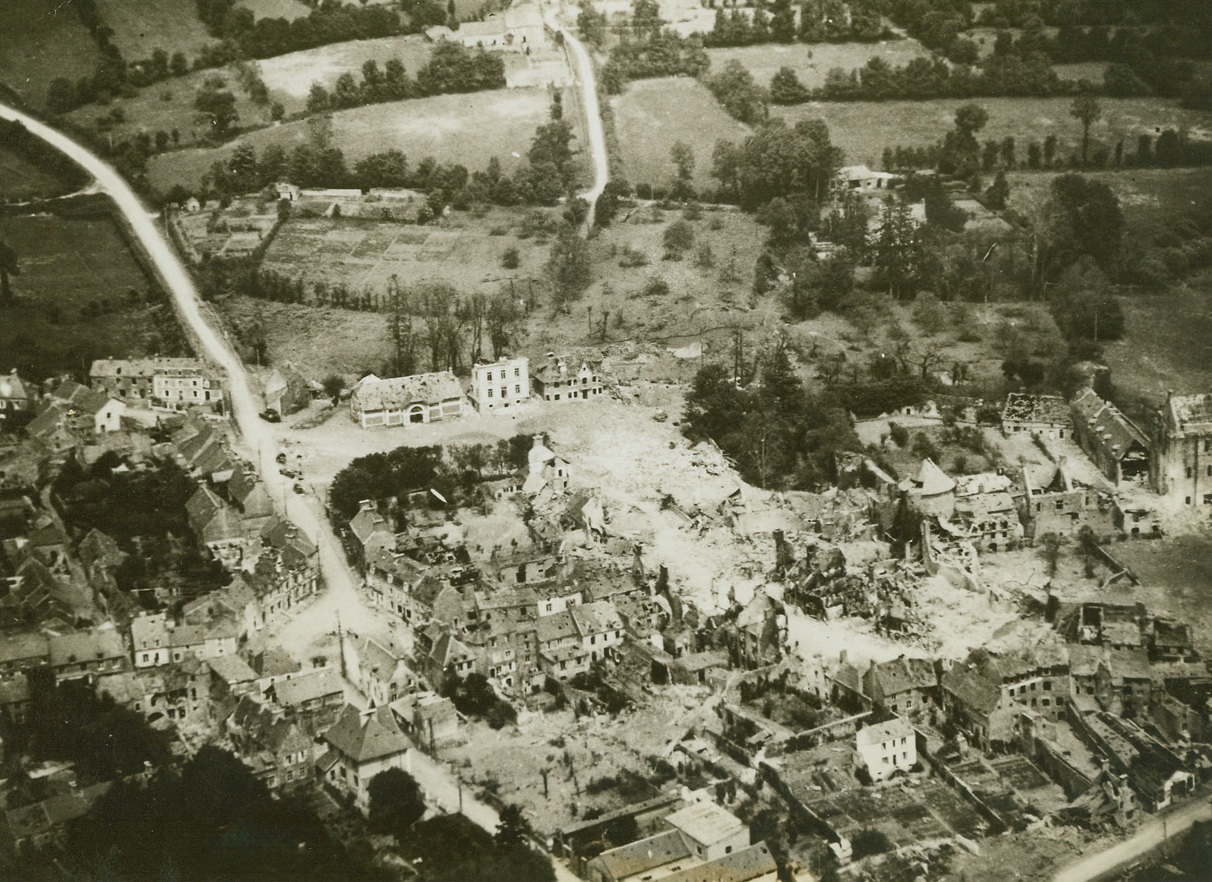 St. Sauveur After German Evacuation, 6/24/1944. St. Sauveur, France – Lying in a valley, this mass of destruction is all that remains of St. Sauveur, captured by the Allies on the road to Cherbourg. Driving a wedge across the Normandy Peninsula with amazing rapidity, the Yank troops have advanced to the outskirts of Cherbourg, and have an estimated 25,000 or 30,000 Germans trapped within the port city. Credit: ACME;