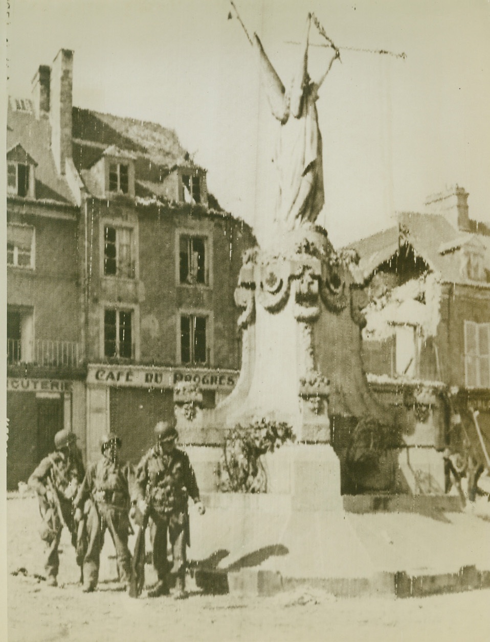 Yank Paratroops in Carentan, 6/15/1944. Carentan, France—A trio of American paratroopers is shown in the streets of battered Carentan, after the French city fell to triumphant Allied liberation forces. Latest protests from Carentan indicate that our troops are holding firm in spite of enemy counterattacks in their sector. Credit: Signal Corps radiotelephoto from ACME;