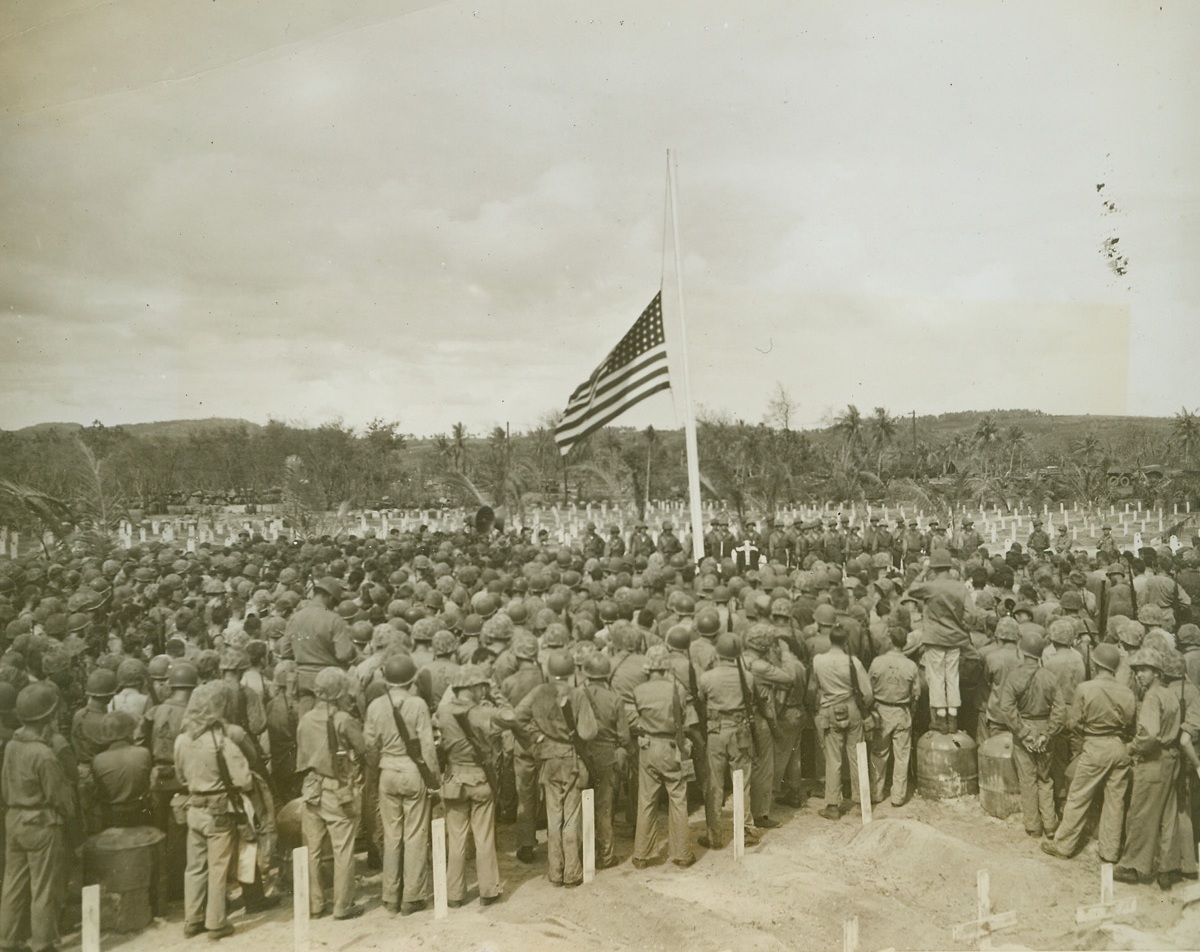 Services For Saipan Dad, 7/26/1944. SIAPAN--In respect for their dead and missing comrades members of the Fourth Marine Division stood solemnly by to hear memorial services by the Catholic, Protestant, and Jewish chaplains in the official Division cemetery on Saipan Island. The Navy today revealed that the conquest for this key base in the Marianas, in American causalities, 3043 killed, 13,049 wounded and 305 missing.  Battle for the island saw the enemy put up the stiffest resistance yet seen in the PacificCredit: WP;