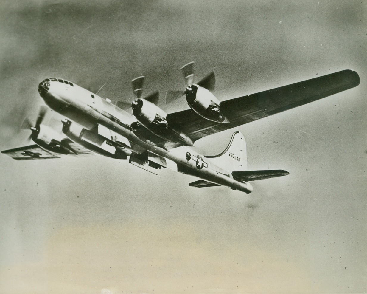 Double Bomb Bays Open, 7/26/1944. SEATTLE, WASH – just released for publication is this photo of the mighty Boeing B-29 Superfortress with it’s two sets of bomb bays’ doors open, ready to pour forth a deadly cargo. To keep the plane’s center of gravity undisturbed, bombs drop from the bays alternately.Credit:  ACME;