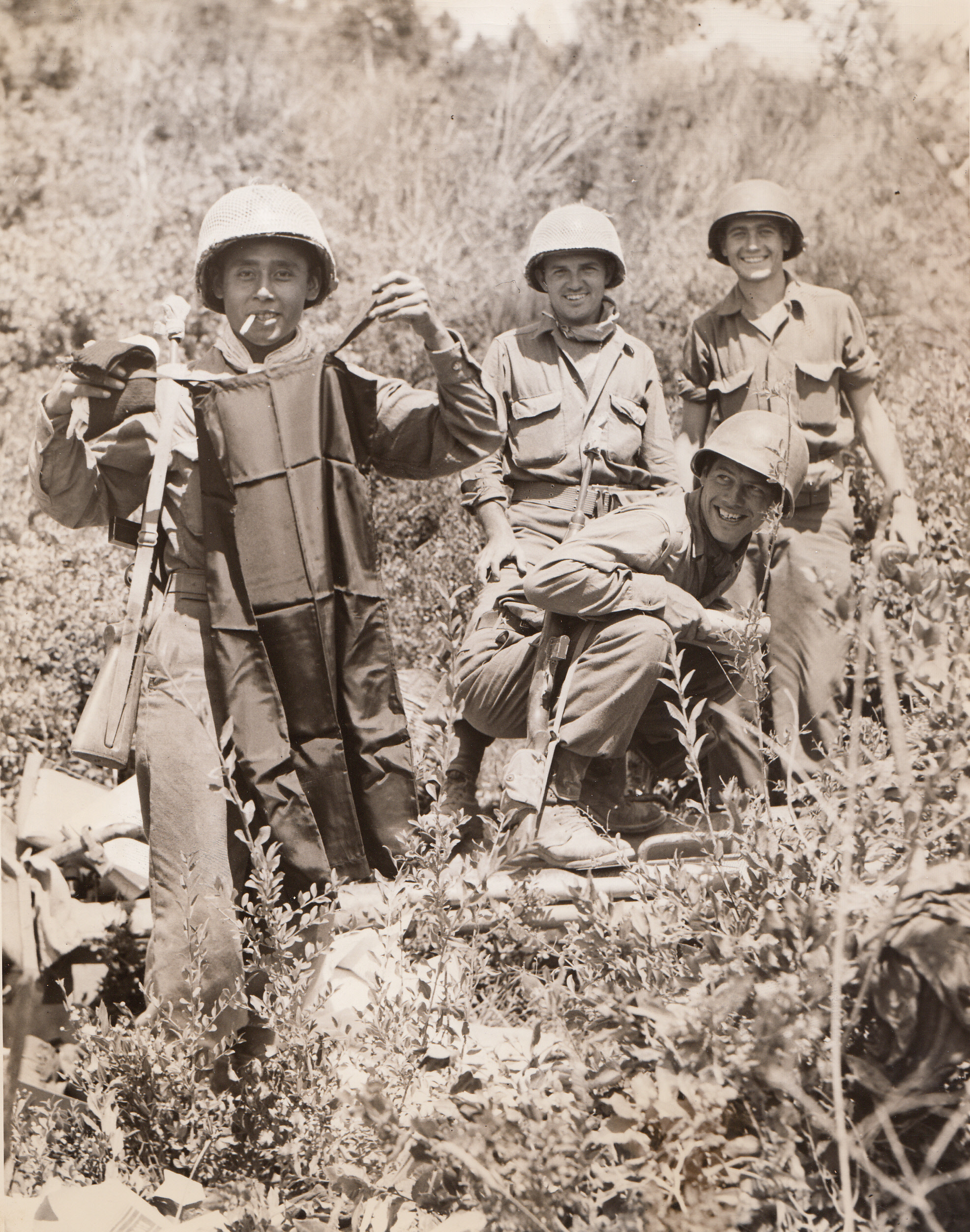 Silk Chemise Now Yank Prize, 7/24/1944. ITALY – Pfc. Ignacio Villarceal, San Antonio, Tex., proudly displays a black silk chemise, war booty which he found near a knocked-out German self-propelled gun in the kit of a dead Nazi. The Germans had looted the silk undergarment from an Italian store. Villarceal is a member of a recon unit near Leghorn.;