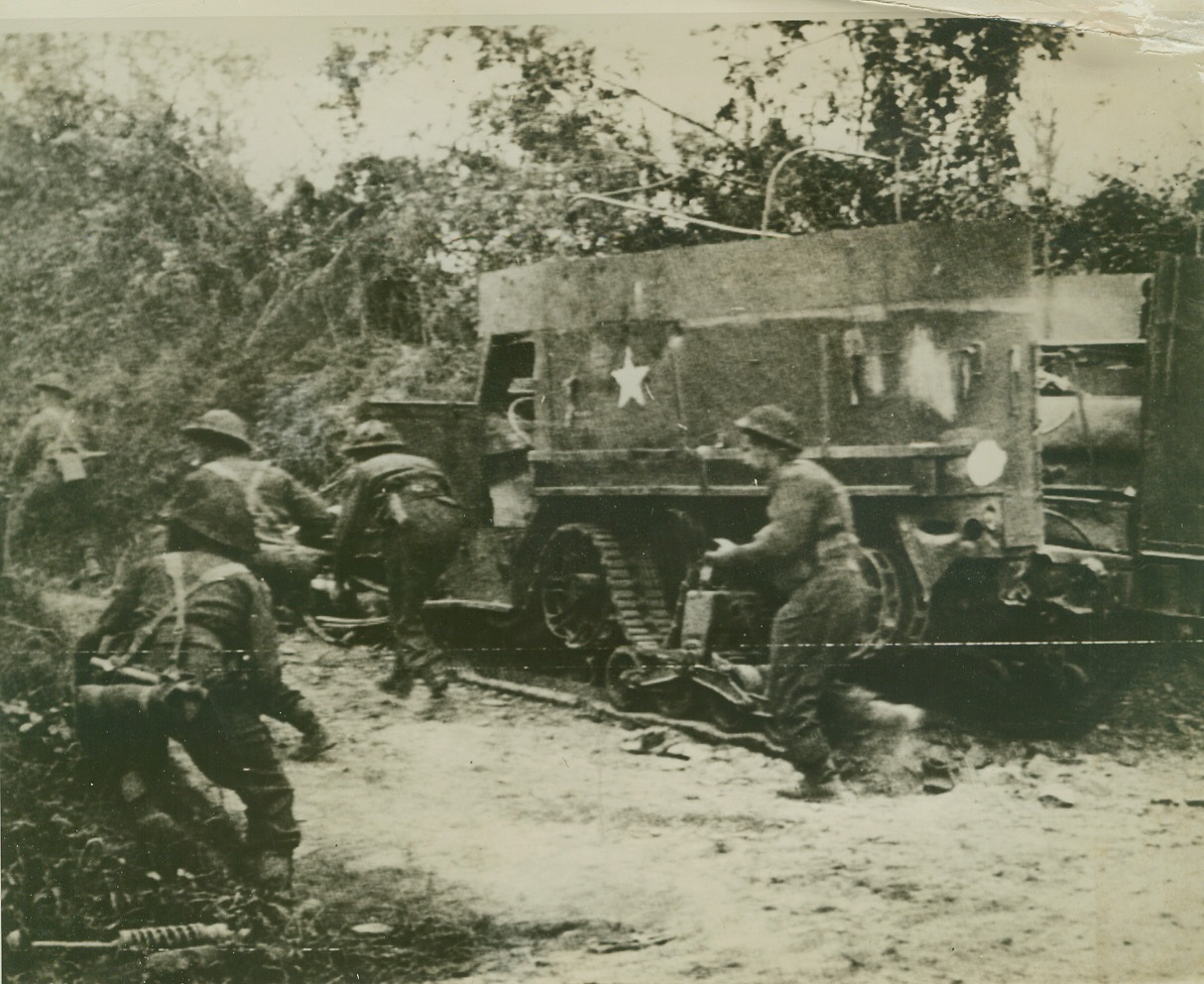 MOPPING UP, 8/7/1944. FRANCE – Crouching as they run, troops of the British Second Army dash ahead on a road near Tracy Bocage. The fighting men are mopping up during their army’s advance across France. Credit: British official photo via U.S. Signal Corps radiotelephoto from ACME;