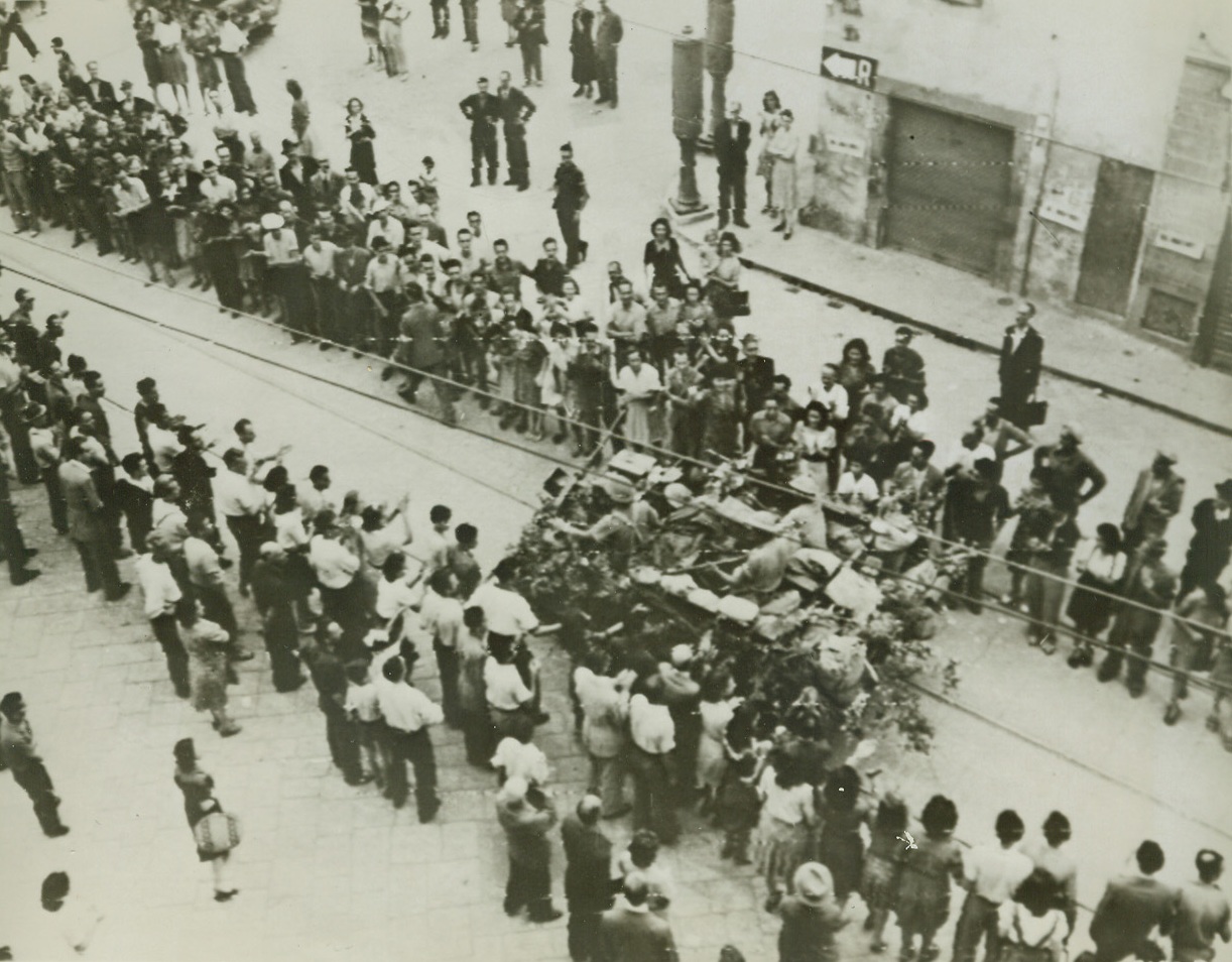 Florentines Cheer Allied Heroes, 8/7/1944. FLORENCE, ITALY – Joyous, cheering throngs line the route as Allied troops make their victorious entry into the southern outskirts of Florence. A vehicle of the South African armored force passes down the aisle formed by applauding, waving natives.Credit (Signal Corps Radiotelephoto from Acme);