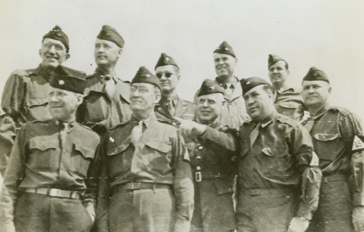 Inspect Yank Equipment in England, 8/19/1944. England – Labor leaders, accompanied by Army officers, tour England to inspect American equipment, and see the use to which it is being put by the A.E.F. In the picture are Lt. Col. Dillman A. Rash, Sherman N. Dalrymple, Col. B.H. Connors, R.J. Thomas, Albert L. Wegener, Eric Peterson, Lt. Col. John B. Watkins, David J. McDonald, and Lt. Col. De Lessers S. Morrison. Credit: Signal Corps Radiotelephoto from ACME;