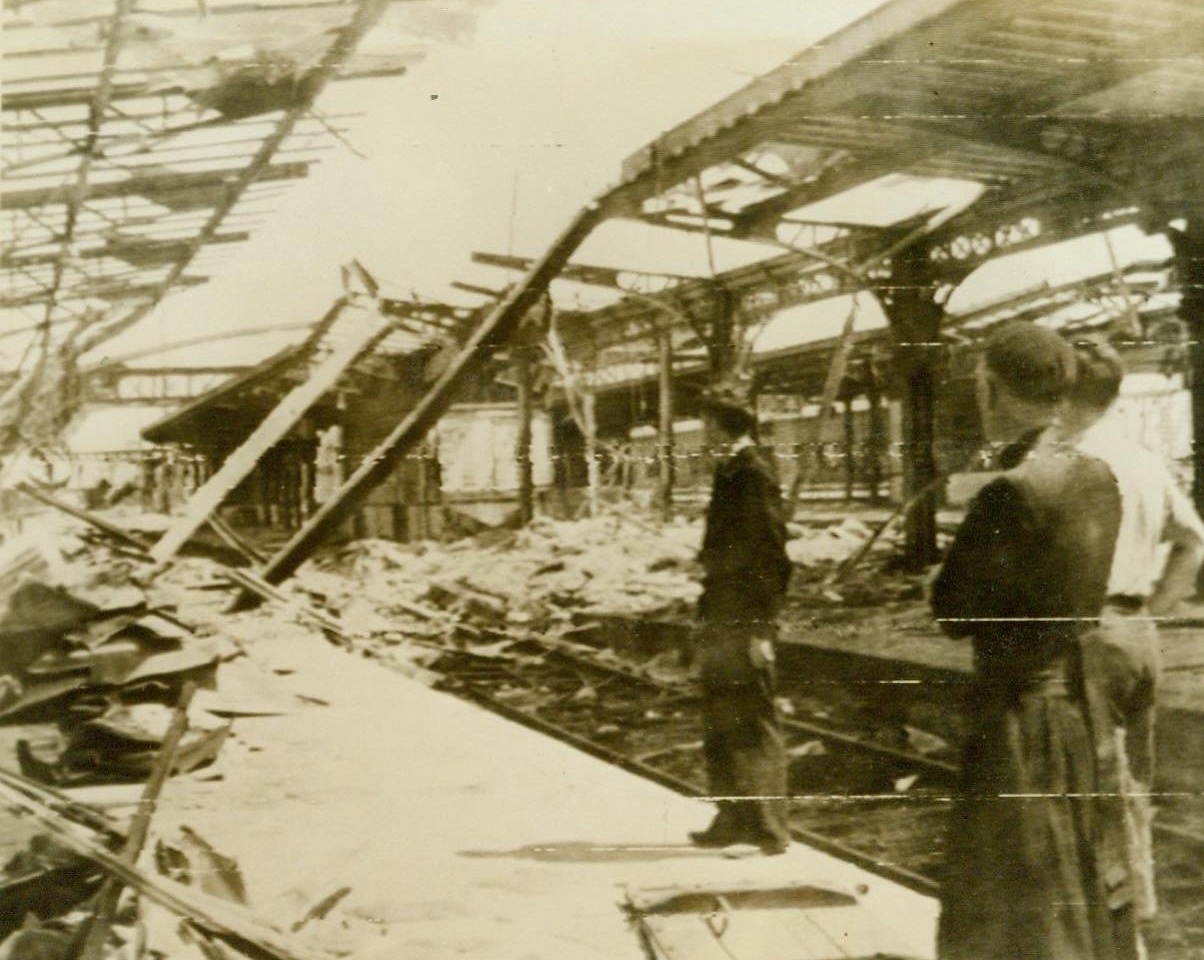 War Took Its Toll In Rennes, 8/6/1944. Rennes, France – The largest city to fall to the Yanks during the Allied march of liberation across France, Rennes was not captured without destruction. The railroad station shown above presented this mass of twisted steel and broken timbers when the Americans took over 8/6/44 (Signal Corps Radiotelephoto from ACME);