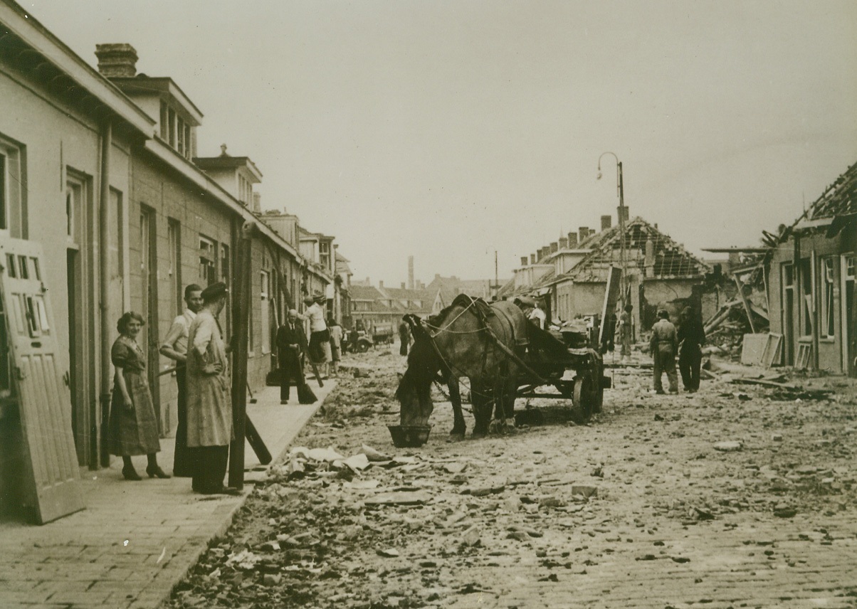 After Nazi Air Raid, 9/28/1944. HOLLAND – Debris from smashed houses litter the streets of Eindhoven, after the Luftwaffe raided the city Sept. 19, in a futile attempt to block further progress by Allied forces passing through in pursuit of the Nazis. Credit Line (British Official Photo from Acme);