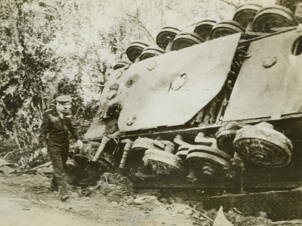 “IKE” INSPECTS THE WORK OF HIS MEN, 9/3/1944. FRANCE – Gen. Dwight D. Eisenhower, supreme commander of the Allied expeditionary forces, inspects an overturned German tank left by a roadside in France by the retreating enemy.Credit: Acme;