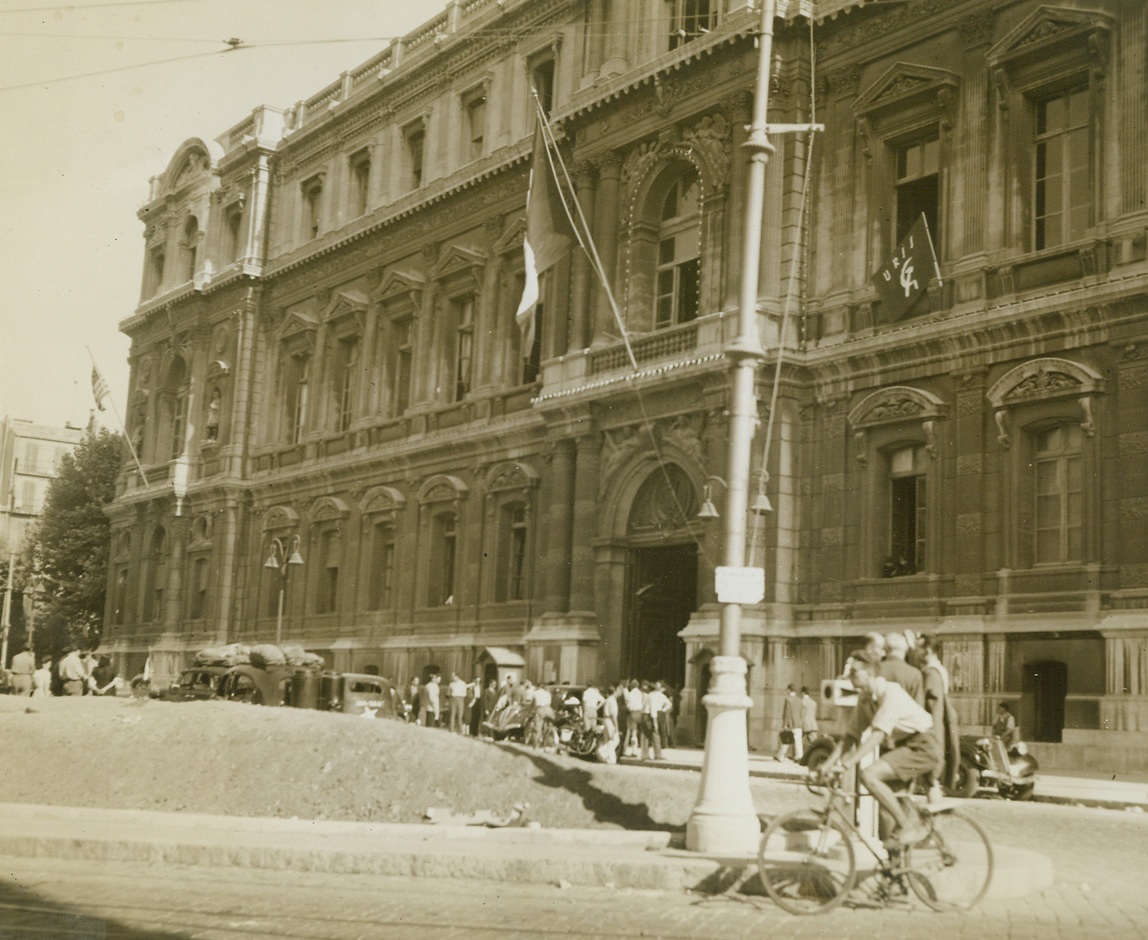 Flags of Victory Fly in Marseille, 9/6/1944.  France - After four century-long years under the Nazi heel and the puppet government of Vichy, the flags of free countries and men once more fly over the prefecture in Marseille after its liberation by Allied Forces. In the center is the tricolor of France raised in glory again. At far left is the stars and stripes of the United States and at right is the red flag of Russia. Credit: ACME photo by Sherman Montrose, War Pool Correspondent;