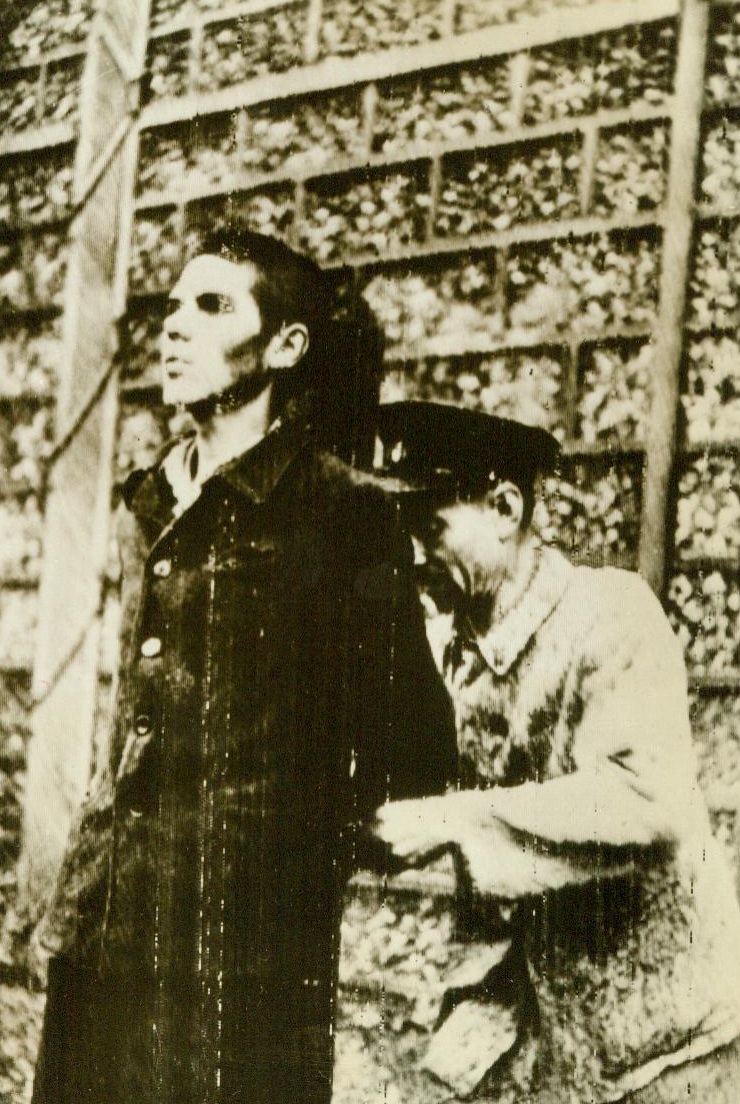 Collaborationist's End, 9/4/1944. Grenoble, France—Found guilty of collaborating with the Germans, this young Frenchman stares straight ahead as he is fastened to the stake for execution by the FFI. He was one of six former members of the French Militia who were condemned to death by a military court 9/4/44 Acme RadioPhoto;