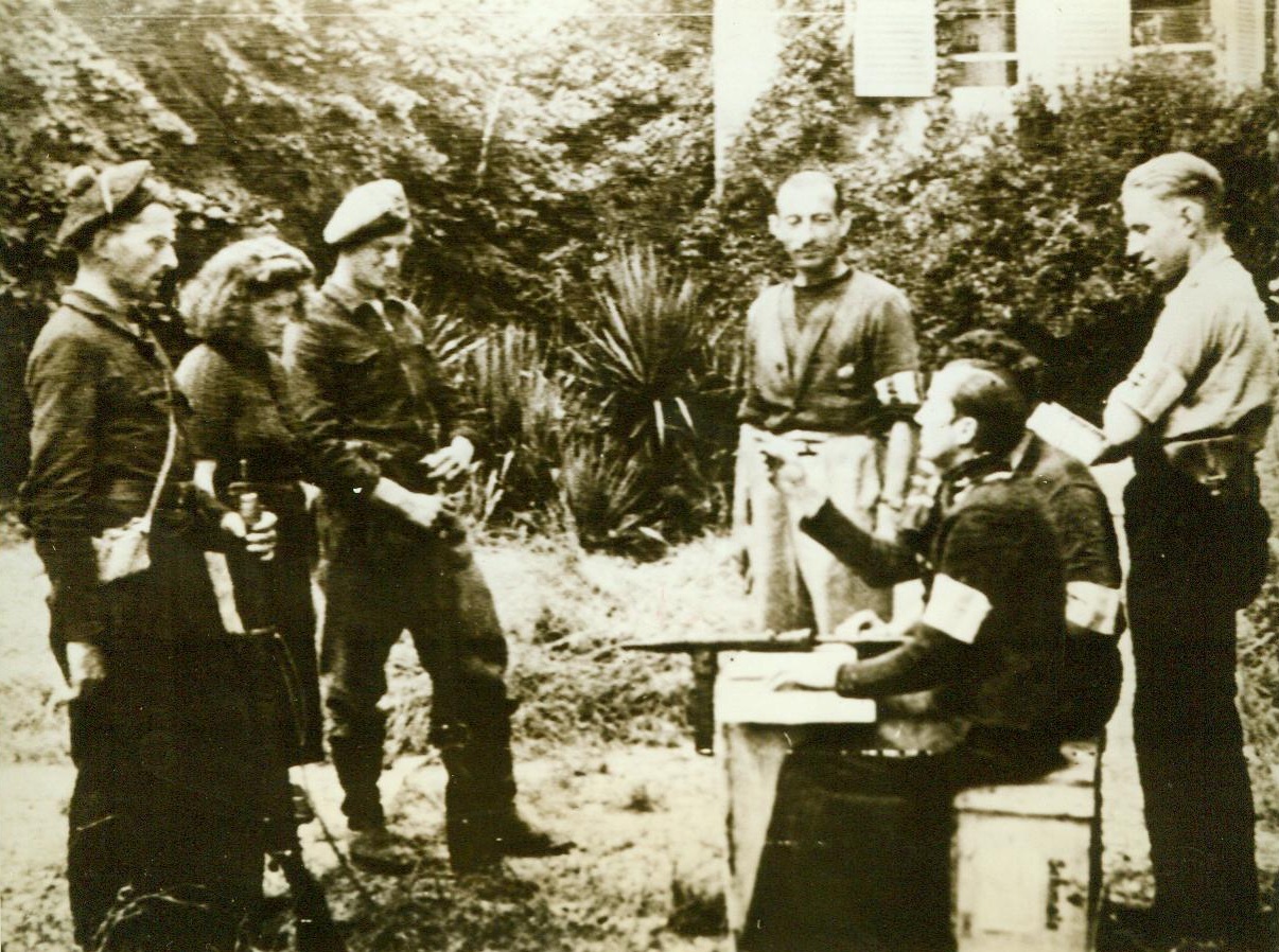 Their Day Has Passed!, 9/27/1944. Citizens of Nijmegen, Holland, accused of collaborating with the Nazis, are rounded up by fellow townsmen, carrying weapons and wearing Dutch Army Helmets. Note the varying shades of fear on the faces of the prisoners 9/27/44 ACME;