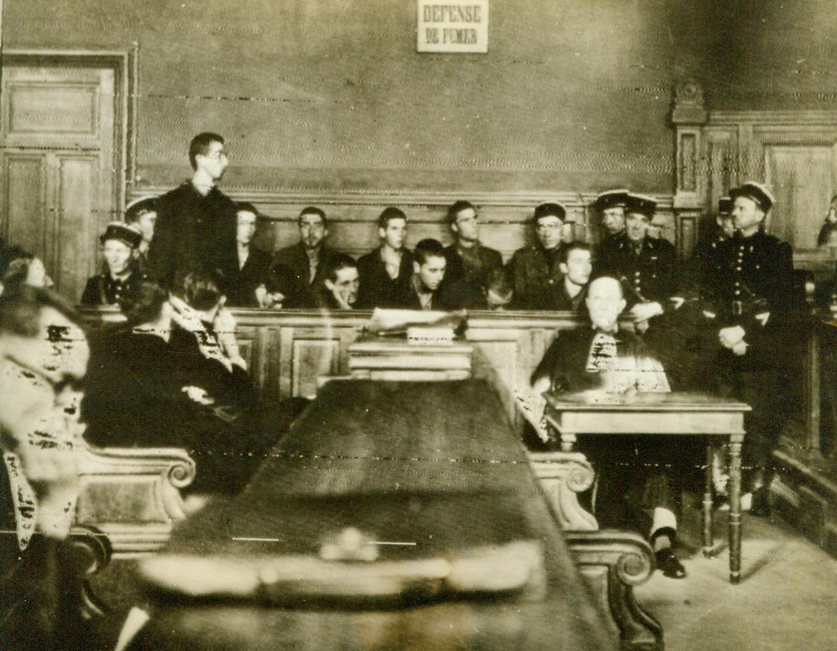 Brought To Trial For Their Crimes, 9/4/1944. Grenoble, France -- Ten youthful Frenchmen- former members of the Militia at Grenoble -- Stand trial on charges of collaborating with the Nazis. A military court condemned six of the accused to death, two to hard labor for life, and two to five years imprisonment. 9/4/44 (ACME);