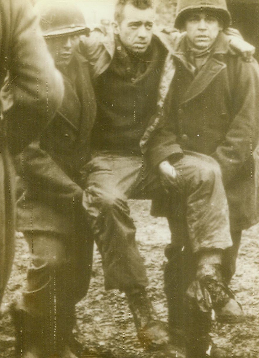 Wounded Yank Prisoner #1, 1/3/1945. Western Front – According to German caption on this photo radioed from Stockholm today, American prisoners are carrying a wounded comrade to a dressing station during the “Big German Winter Offensive at the West Front.” Credit Line (ACME RADIOPHOTO) 1/3/45;