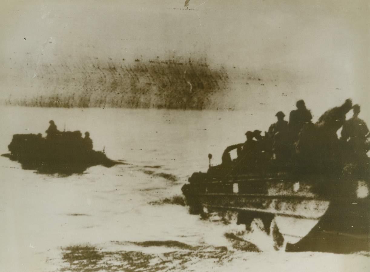 Noses Toward Italy. Sicily – Two amphibious jeeps take off from Sicily and churn their way toward Italy and the long-awaited invasion of the European continent. With such a short distance to travel across the Messina Straits, the land-sea vehicles could travel under their own power before landing in Italy to batter their way inland.(Photo radioed from Algiers to N.Y.);