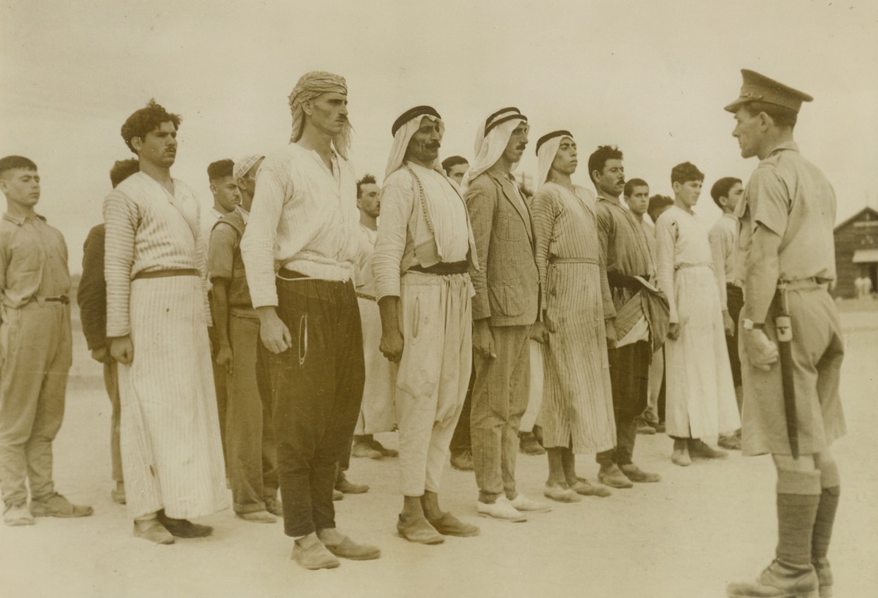 Press inspection of motive in N. Africa by British officers..