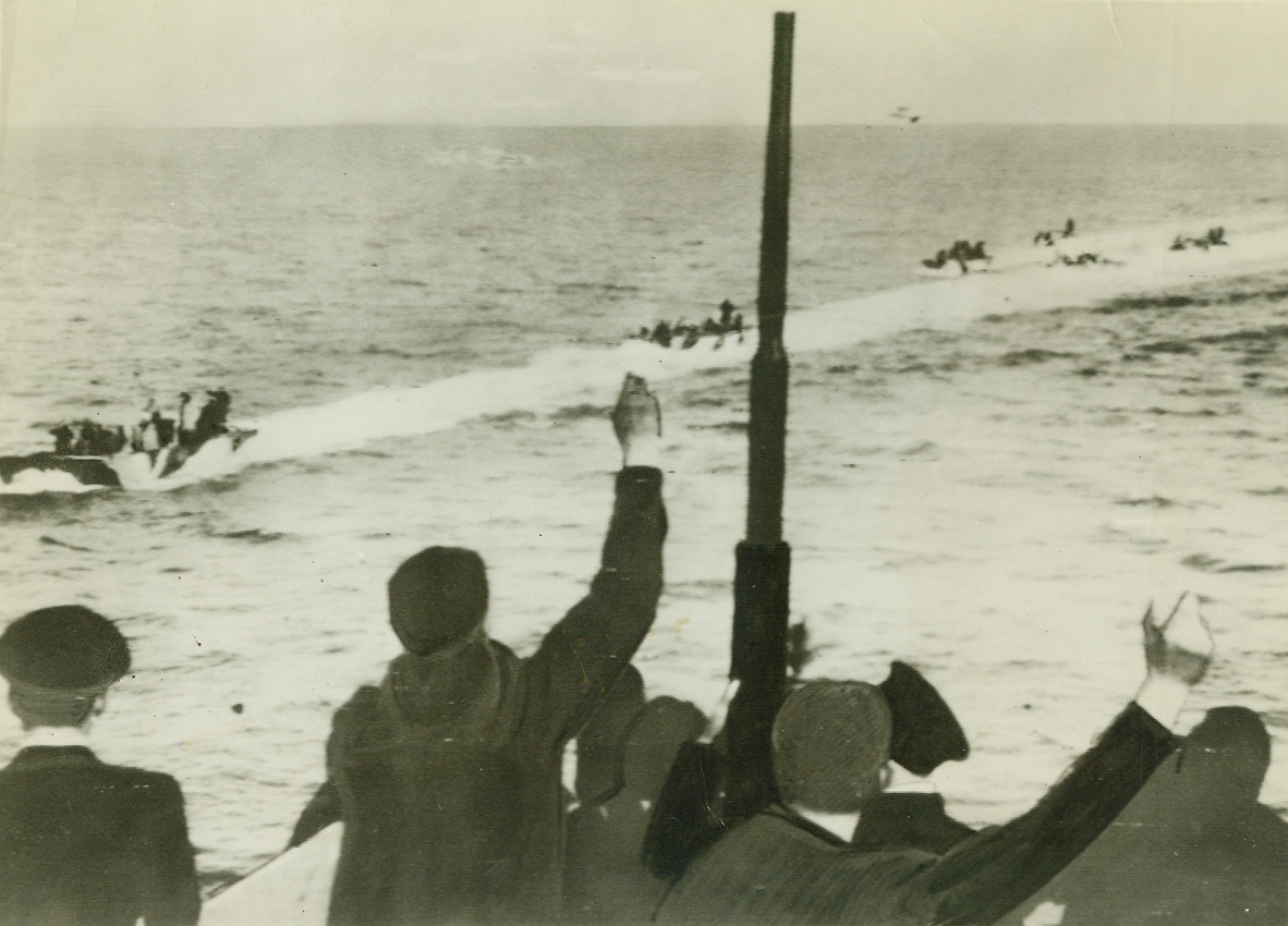 No Title. Sailors aboard British ship cheer British paratroopers in small landing craft as latter speed back across Channel following surprise raid on German radio station at Bruneval, near LeHavre, France, Feb. 27. (ACME Radiophoto from Telephoto);