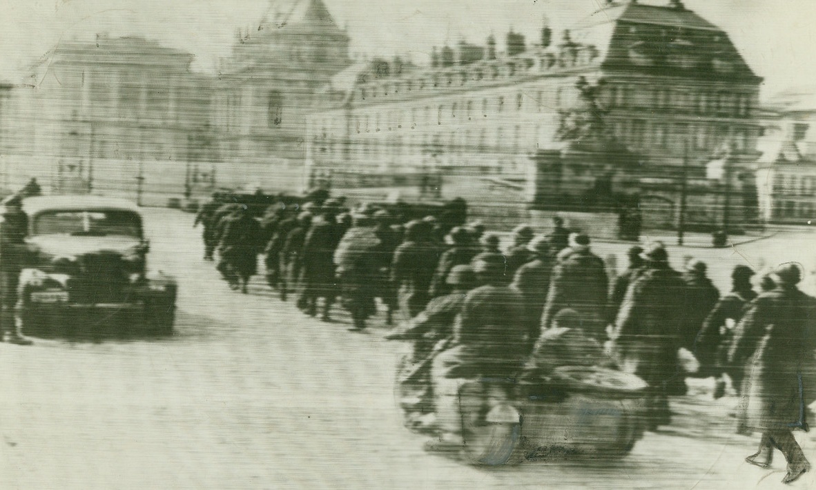 No Title. Captured French soldiers in front of Palace at Versailles, according to caption from German source. Photo flown to Berlin. Radioed to New York;