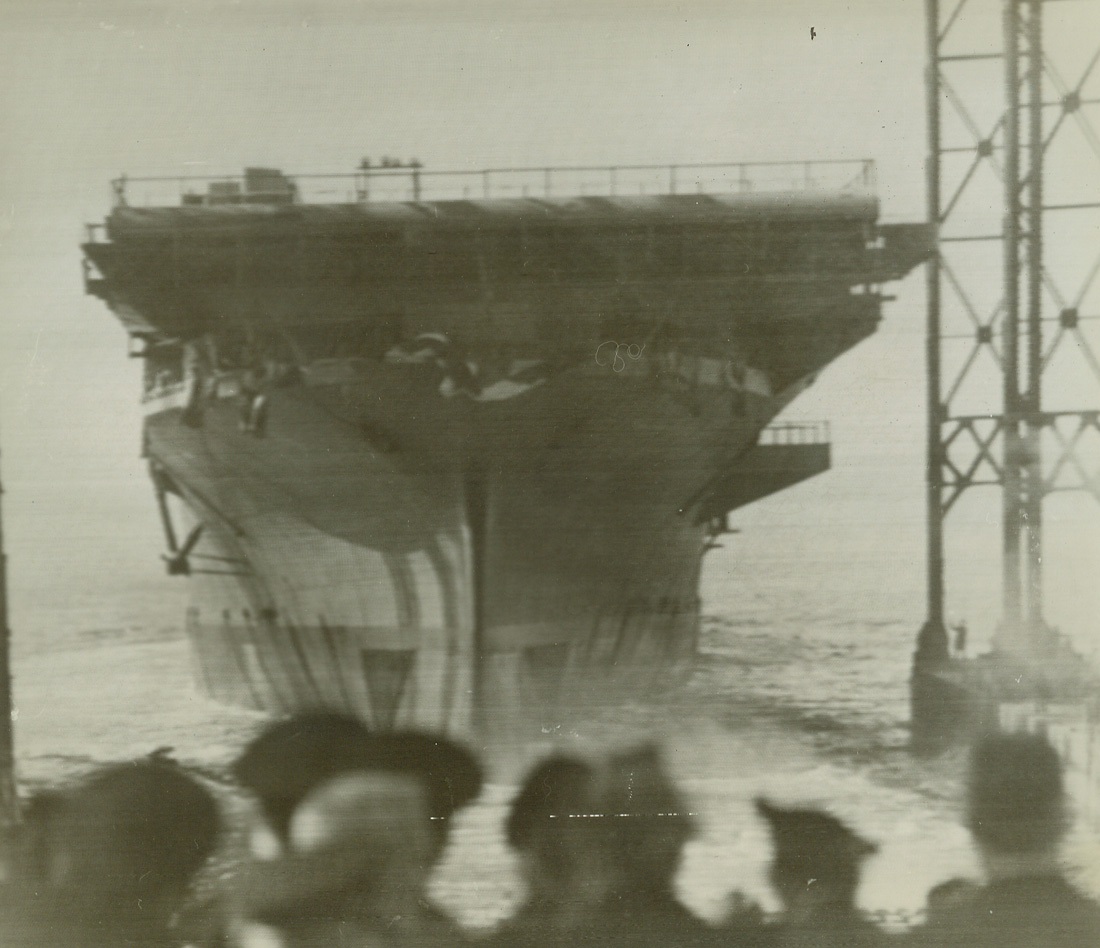 Newport News, Va – USS Yorktown slides down ways at Newport News Shipbuilding and Drydock (Illegible).