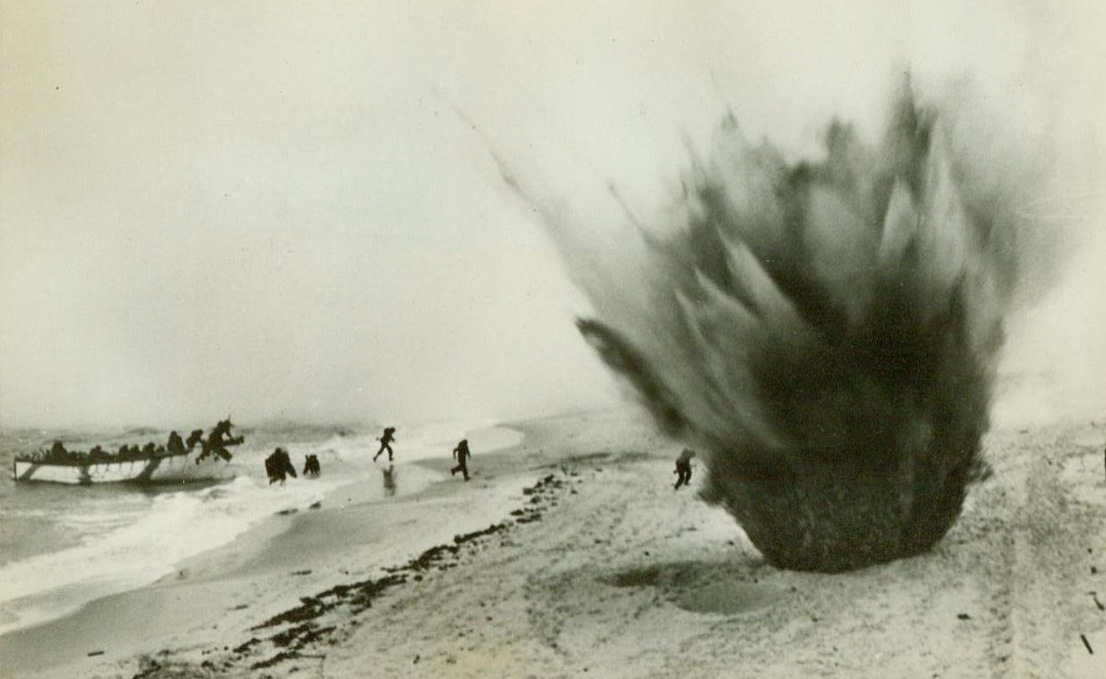 Prelude to invasion. ENGLAND – Because it is generally conceded that the invasion of Europe will be the toughest venture of the war, Canadians in Britain are training day and night under spectacularly realistic conditions. Here T.N.T. charges are detonated by the “enemy” as Canadians land on a special strip of beach after a quick trip out to sea from another point on the coast. Two Canadians were hit in this maneuver, but not seriously injured.;