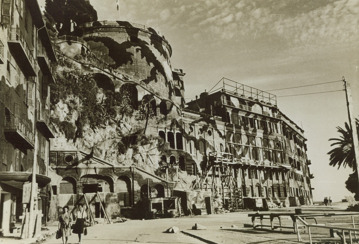 French Resort Wears Camouflage Dress. Nice, France -- The camouflage dress on the buildings along the Quai des Etats-Unis, famous waterfront boulevard in Nice, signifies its change from a famous southern France resort to an important war objective. Nice was liberated by Allied invasion forces in southern France in the same week that Paris and Marsaille were taken. Credit: ACME;