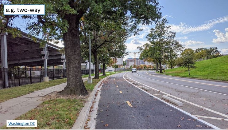 Example of a two-way cycle tracks protected by parking stops only.