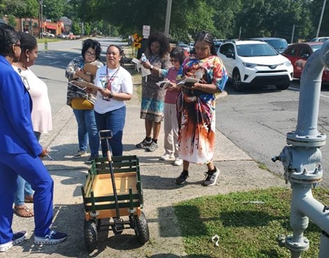 Shanetta Agnew leads walk audit with Figure A-3.  Pictured from left-right: Jo Thompson, Amanda Hunter, Rachel Johnson, Sheila Couch, Sheryl Alexander, Tsai Mei, Teneice Floyd.