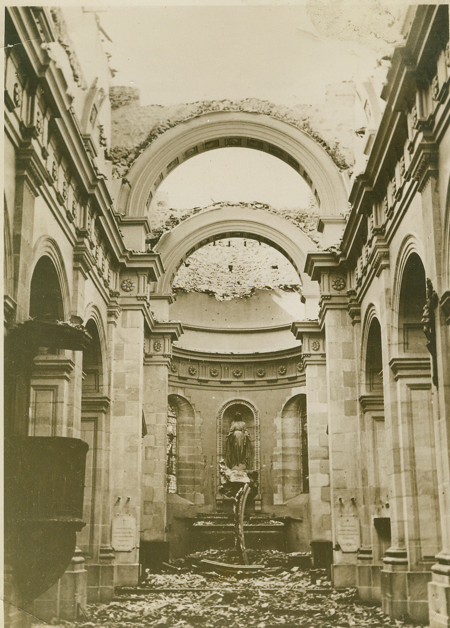 Bombs Wreck Church in France, 5/29/1940  France—Its vaulted ceiling blasted away, this church in France stands roofless after an attack by German airmen. Credit: ACME;