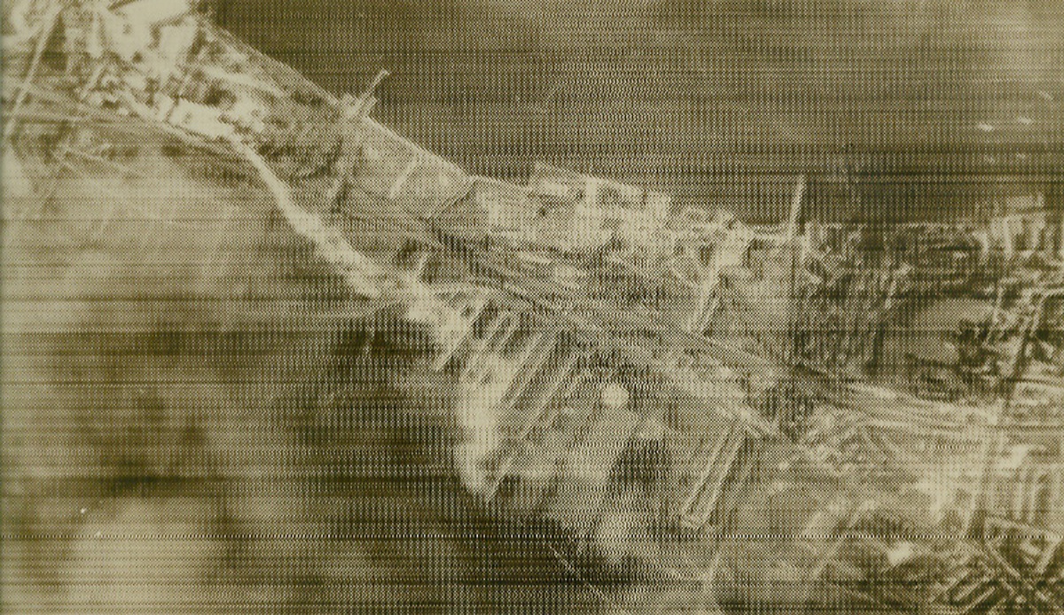 German View of London, 9/10/1940  London—This picture was snapped from a low-flying German bomber flying over the Thames River during the last bombing attacks on London last Saturday. At left, clouds of smoke may be seen drifting southwest from a burning warehouse. This picture, believed to be the first made of the mass raids, was passed by German censor and sent from Berlin by radio on Sept. 10th. Credit: ACME.;