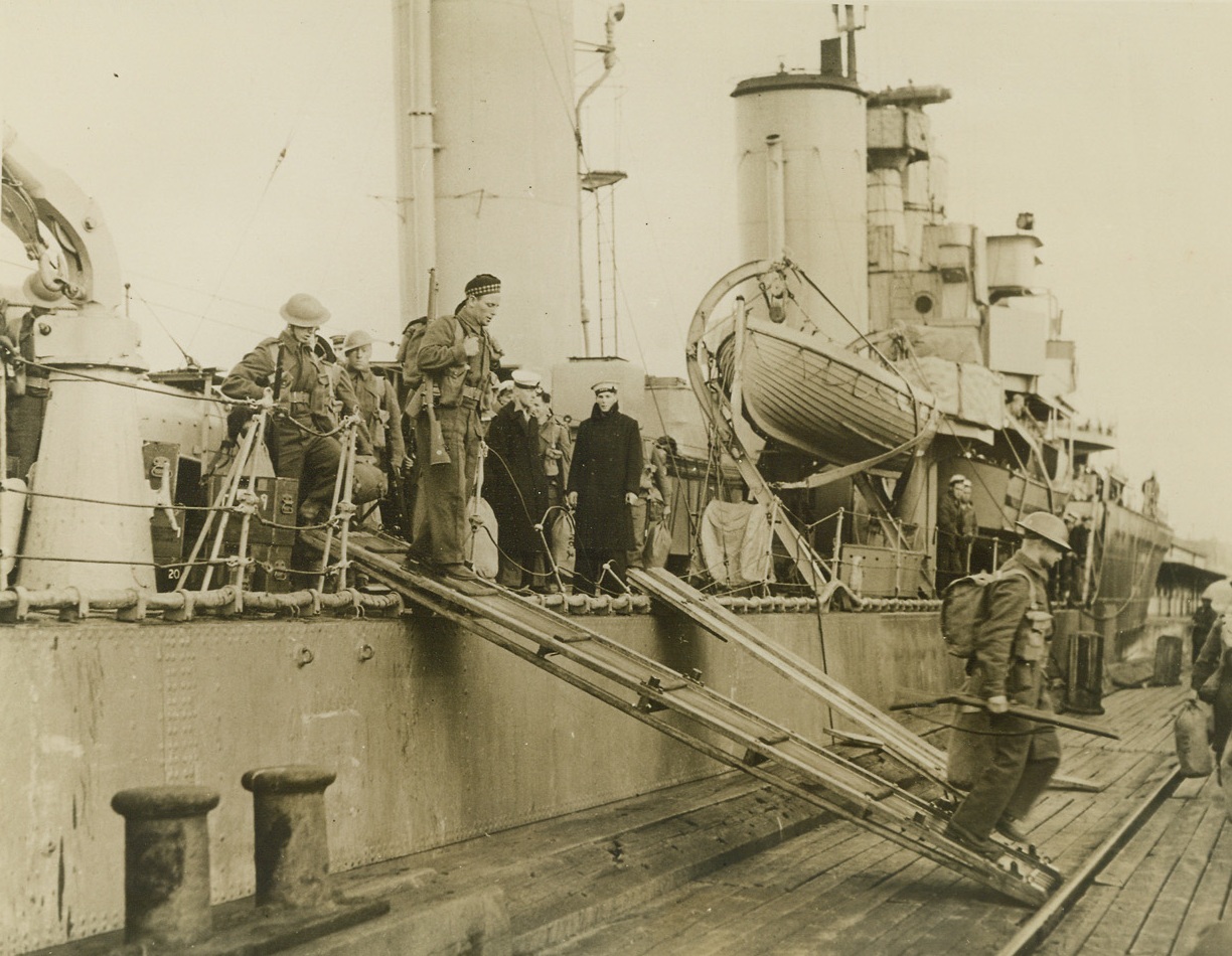 Safe Landing, 9/19/1940  Newfoundland – Canadian troops walk down the gang-plank upon arrival in Newfoundland for duty. They were transported without incident by destroyers of the Royal Canadian Navy. Credit: ACME;