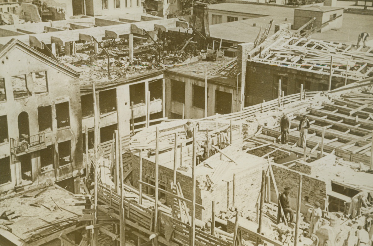 Finland Rebuilds, 10/11/1940  HELSINKI, FINLAND—As Europe is razed by devastating air raids, little Finland is busy rebuilding and repairing havoc wrought by the military claws of the Russian bear when it came lumbering into the frozen North. This photo shows men at work rebuilding in Helsinki against a background of bomb blasted buildings. Credit: ACME;