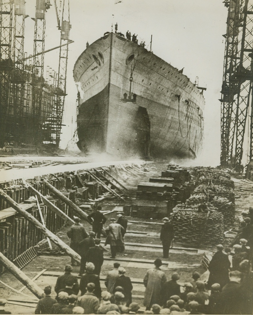 British Battleship Launched, 1/14/41  CLYDESIDE -- The 35,000-ton British battleship "Duke of York" slides into the water on the Clydeside after launching ceremonies presided over by Queen Elizabeth and King George. She is one of five ships of this class which were started before the war broke out. Credit: (ACME);