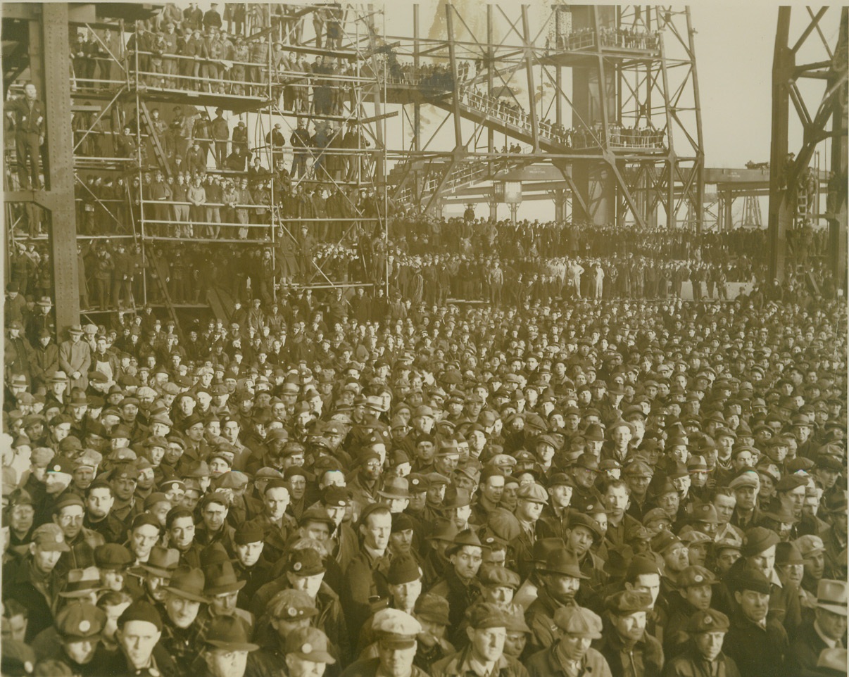 LAY KEEL OF SUPER-DREADNAUGHT, 1/25/41  PHILADELPHIA, PA: - Seven thousand workers of the Philadelphia Navy Yard, as well as Naval and Wisconsin State Officials, crowded every nook and corner within sight of the ceremonies to witness the laying of the keel of the 45,000-ton Super-Dreadnaught Wisconsin, January 25. Cost of constructing the vessel will be $90,000,000. Credit: ACME;