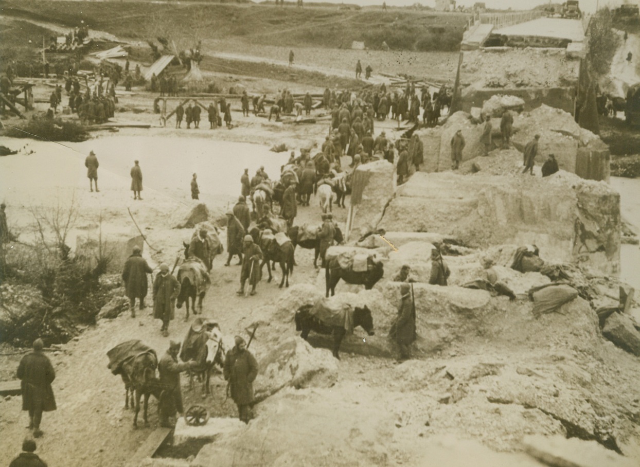 ON THE RETREAT, ITALIANS LEAVE RUIN IN ALBANIA, 2/7/41  ON THE ALBANIAN FRONT—Retreating Italians, fleeing the cold steel and dauntless courage of victorious Greek forces, dynamited this bridge near Kligura as an obstacle in the path of the victors. This is one of the first pictures to reach the United States of the war in Albania.;