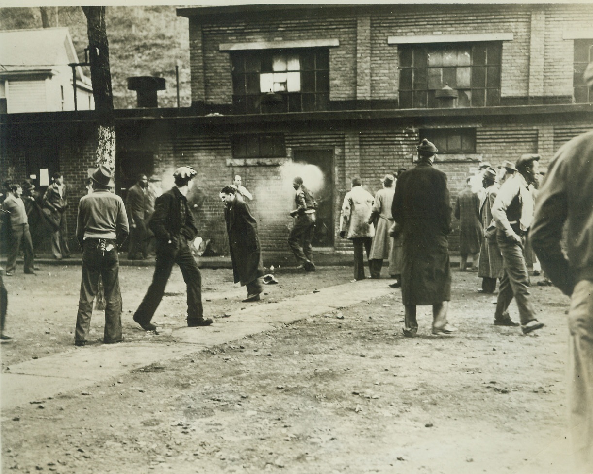 Strike Clash in West Virginia Captive Mine., 11/18/41  Gary, W. VA.—One man was injured in a clash between pickets and members of an independent miner’s union at a captive mine, operated by the United States Coal & Coke Co., in Gary, November 18. The action occurred, when the independent miners tried to enter the mine and the pickets barred their way. Steel bars were hurled, with a liberal sprinkling of rocks, by both sides. Photo above shows one hapless victim being sprayed with a hose. Credit: ACME.;